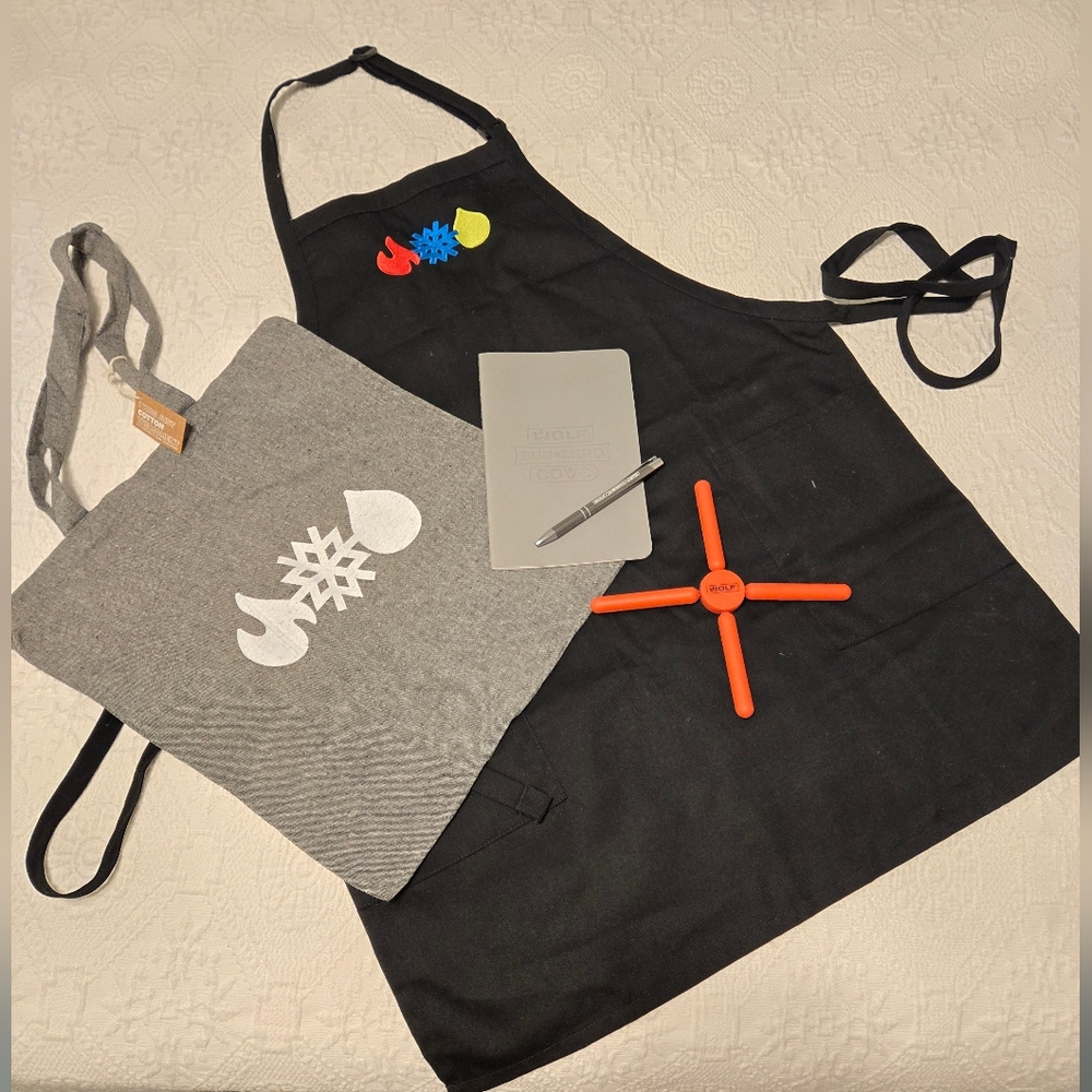 SUBZERO/WOLF Apron, Note Book, Pen, Bag and  Orange Foldable Silicone Trivet